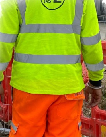 JAS2 operative in hi-vis on site
