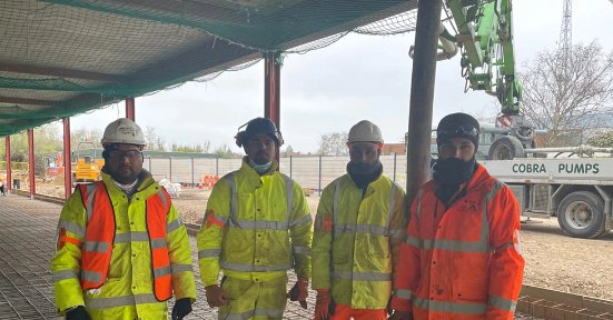 JAS2 groundworks crew on site with a concrete pump